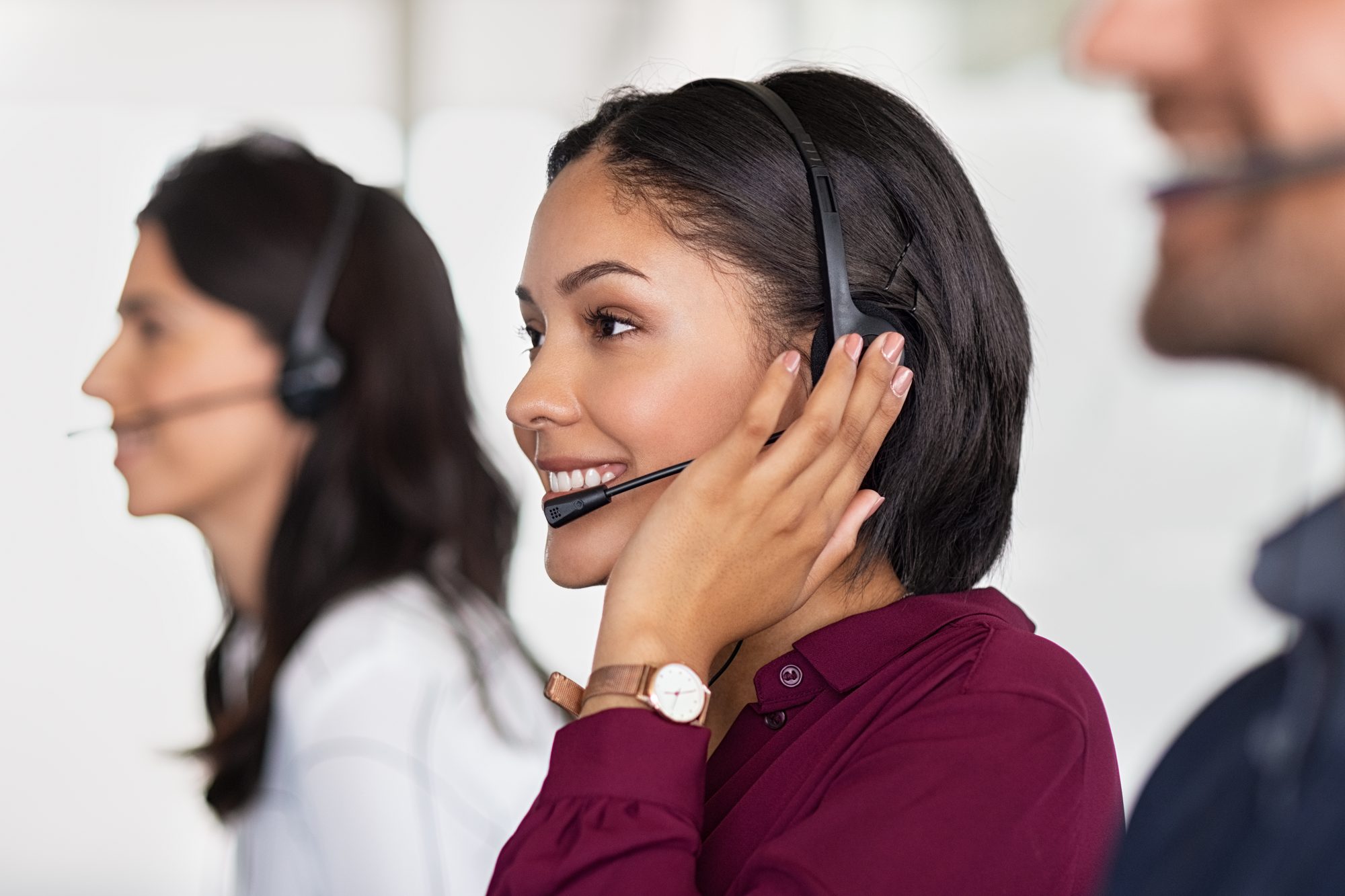 Bilingual call center team members on headsets